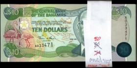 BAHAMAS. Central Bank. 10 Dollars, 1974. P-64. Uncirculated.
80 pieces in lot. A large group of 10 Dollars Bahamas notes, found printed in dark green...