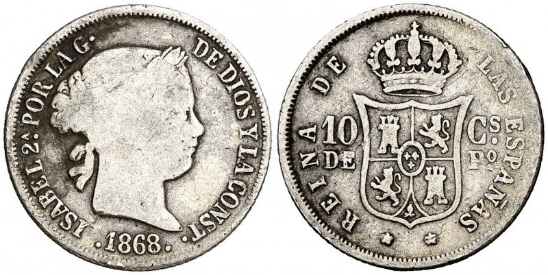1868/7. Isabel II. Manila. 10 centavos. (AC. 655.1). 2,47 g. Rara sobrefecha, qu...