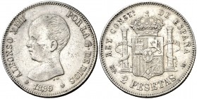 1889*1889. Alfonso XIII. MPM. 2 pesetas. (AC. 82). 10 g. Mínimas hojitas. Parte de brillo original. Ex Colección Manuela Etcheverría. MBC+/MBC.