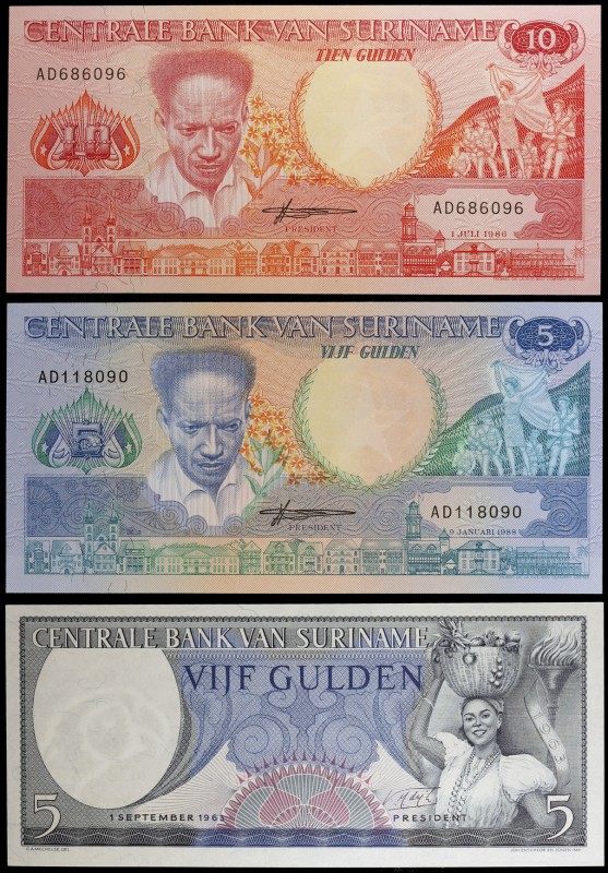 1963, 1986 y 1988. Surinam. Banco Central. 5 (dos) y 10 gulden. 3 billetes. S/C.