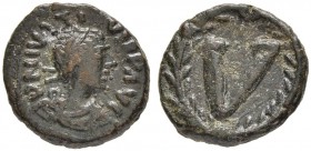 THE BYZANTINE EMPIRE
JUSTINIANUS I, 527-565
Undetermined Sicilian Mint
Ae-Pentanummium 540-565. Sear 337. DOC 369. MIB 246. 3.75 g. Rare. Dark gree...