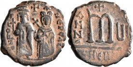 Phocas, 602-610. Follis (Bronze, 28 mm, 10.32 g, 12 h), with Leontia, Theoupolis (Antiochia), RY 6 = 607/8. O N FOCA NЄ PЄ AV Phocas standing facing, ...