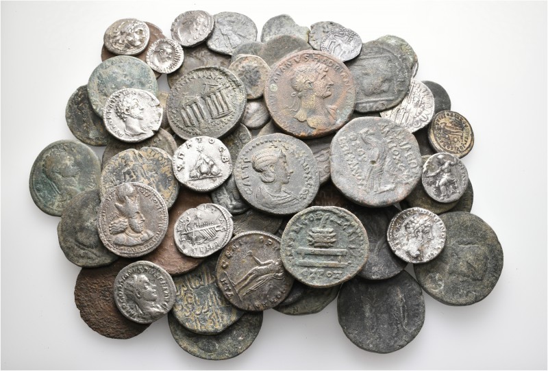 A lot containing 12 silver and 57 bronze coins. Includes: Greek, Roman Provincia...