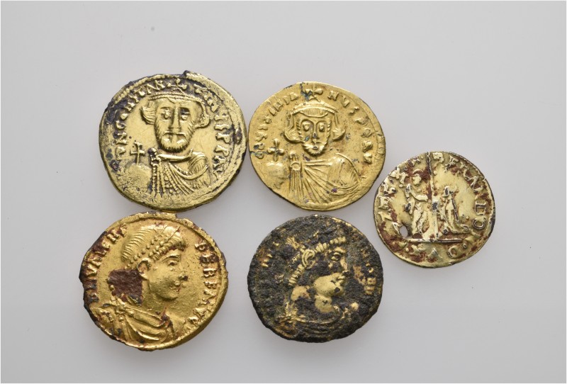 A lot containing 5 plated gold coins. Includes: Roman Imperial, Byzantine and Mo...