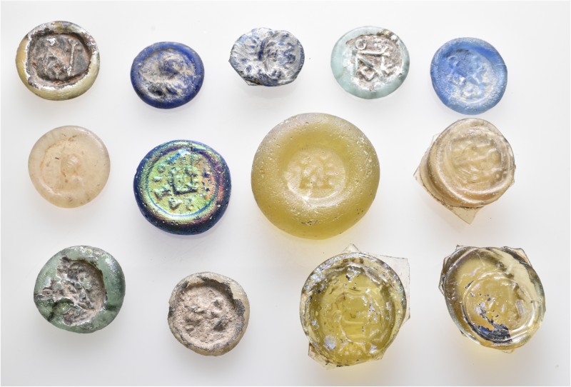 A lot containing 13 glass weights. Includes: Byzantine and Islamic. Fine to very...