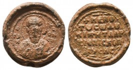 Byzantine lead seal of Niketas archbishop of Nyssa (11th cent.). 
Obv.: Bust of saint Gregorios of Nyssa in Asia Minor, facial, nimbate, holding the b...