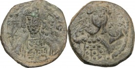 Michael VII Ducas (1071-1078). AE Follis, Constantinople mint. D/ Facing bust of Christ, raising hand in benediction and holding Gospels; nimbus with ...