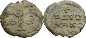 Lead Seal, c. 8th-10th century. D/ Cruciform invocative monogram. R/ Inscription in four lines; beneath, cross; all within wreath. PB. g. 19.66 mm. 30...