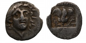 Rhodos, Rhodes AR Hemidrachm. 'Plinthophoric' coinage. Athanodoros, magistrate. Circa 170-150 BC. Radiate head of Helios facing slightly right / Rose ...