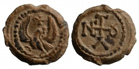 Byzantine Pb Seal, c. 7th-12th century Eagle standing facing, head r., wings spread; Christogram above. Cruciform monogram. Condition: Very Good 9 gr....