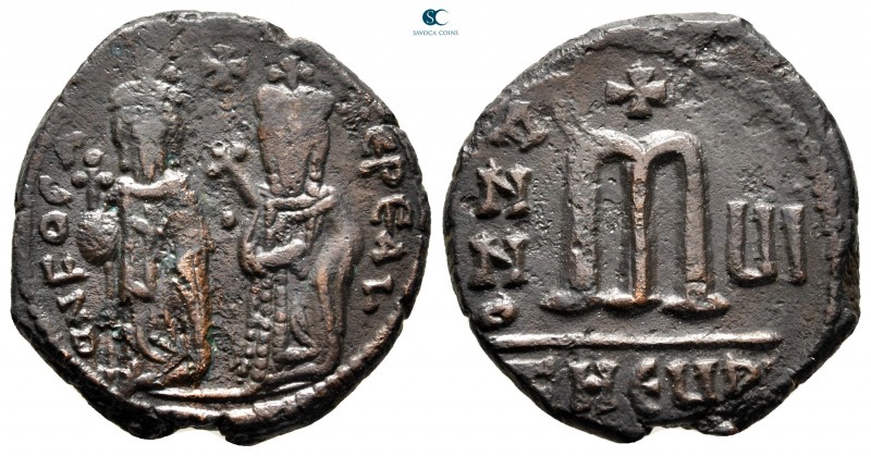 Phocas, with Leontia AD 602-610. Theoupolis (Antioch)
Follis Æ

27 mm., 9,28 ...