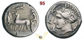SICILIA - SyracusaeEpoca di Dionisio I (405-367 a.C.) Tetradracma. D/ Quadriga briosa; in alto la Nike in volo incorona l'auriga e all'esergo delfino ...