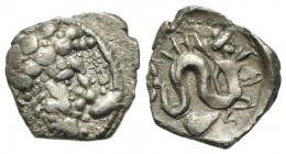 Campania, Allifae, Obol, ca. 325-275 BC. AR (0.58 g, mm 10; h 12). Laureate head of Apollo r.; [three dolphins] around; Rv. Skylla r., holding sepia a...