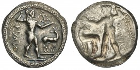 Bruttium, Kaulonia, Stater, ca. 500-480 BC; AR (g 7,83; mm 26; h 12); KAVLO (retrograde), Apollo advancing r., holding branch; small daimon running r....