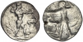 Bruttium, Kaulonia, Stater, ca. 475-470 BC; AR (g 8,12; mm 21; h 12); Apollo advancing r., holding branch; small daimon running r. on Apollo's l. arm;...