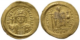 Justinian I (527-565); AV Solidus (g 4,49; mm 21; h 6); Constantinople, 545-565; Helmeted and cuirassed bust facing, holding globus cruciger and shiel...