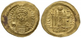 Justinian I (527-565); AV Solidus (g 4,47; mm 20,5; h 6); Constantinople, 545-565; Helmeted and cuirassed bust facing, holding globus cruciger and shi...
