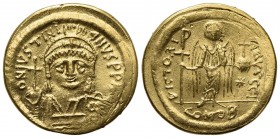Justinian I (527-565); AV Solidus (g 4,26; mm 19,5; h 6); Constantinople, 545-565; Helmeted and cuirassed bust facing, holding globus cruciger and shi...