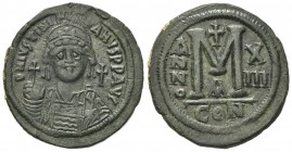 Justinian I (527-565); AE 40 Nummi (g 22.93; mm 38; h 6). Constantinople, year 13 (AD 539/40). Helmeted and cuirassed facing bust, holding globus cruc...