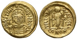 Justinian I (527-565); AV Solidus (g 4,47; mm 20; h 6); Carthage, year 10 (AD 546/7); Helmeted and cuirassed bust facing, holding globus cruciger and ...