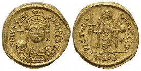 Justinian I (527-565); AV Solidus (g 4,47; mm 20; h 6); Carthage, year 11 (AD 547/8); Helmeted and cuirassed bust facing, holding globus cruciger and ...