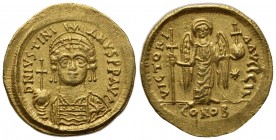 Justinian I (527-565); AV Solidus (g 4,47; mm 20; h 6); Carthage, year 11 (AD 547/8); Helmeted and cuirassed bust facing, holding globus cruciger and ...