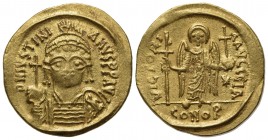 Justinian I (527-565); AV Solidus (g 4,40; mm 19,5; h 6); Carthage, year 11 (AD 547/8); Helmeted and cuirassed bust facing, holding globus cruciger an...