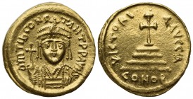 Tiberius II (578-582); AV Solidus (g 4,47; mm 20,5; h 6); Constantinople. Crowned and cuirassed bust facing, holding globus cruciger and shield; Rv. C...