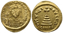 Tiberius II (578-582); AV Solidus (g 4,44; mm 20; h 6); Constantinople. Crowned and cuirassed bust facing, holding globus cruciger and shield; Rv. Cro...