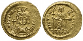 Maurice Tiberius (582-602); AV Solidus (g 4,45; mm 21,5; h 6); Constantinople, 583/4-602; Helmeted, draped and cuirassed bust facing, holding globus c...