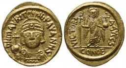 Maurice Tiberius (582-602); AV Solidus (g 4,46; mm 19; h 6); Carthage, year 6 (587/8); Helmeted, draped and cuirassed bust facing, holding globus cruc...