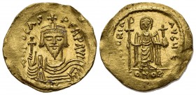 Phocas (602-610); AV Solidus (g 4,48; mm 22; h 6); Constantinople, 607-610; Crowned, draped and cuirassed bust facing, holding globus cruciger; Rv. An...