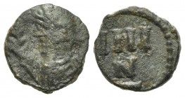 Vandals, 4 Nummi, ca. 480-533. AE (g 0,98; mm 10). Carthage, ca. 523-533. Diademed and draped bust l., holding palm; Rv. N/IIII in two lines across fi...
