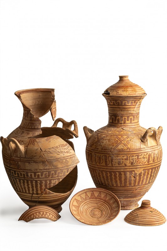 Couple of Greek Geometric Amphorae, 8th century BC; height max (with lid) cm 43,...