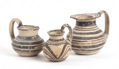 Group of Three Daunian Jugs, ca. 550 - 400 BC; height max cm 13, diam. max cm 9,5. Provenance: English private collection, acquired by the current own...