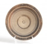 Messapian Dish-Plate with Concentric Circles, 4th - 3rd century BC; diam. cm 19,5; With suspension holes. Intact. Provenance: English private collecti...
