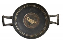 Apulian Stemless Kylix in Gnathia Style, 4th century BC; height cm 6,5, diam. cm 14; Characterized by a central white swan, in profile, inscribed in m...