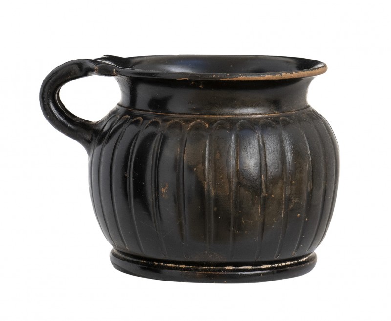 Apulian Black-Glazed Ribbed Cup, 4th - 3rd century BC; height cm 8,5, diam. cm 9...