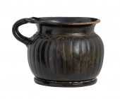 Apulian Black-Glazed Ribbed Cup, 4th - 3rd century BC; height cm 8,5, diam. cm 9; Very elegant and intact. Provenance: English private collection, acc...