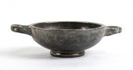 Apulian Black-Glazed Small Double Handled Bowl, 4th - 3rd century BC; height cm 4,5, diam. cm 11,5. Provenance: English private collection, according ...
