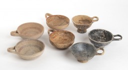 Group of Seven Daunian and Apulian Handled Bowls, 5th - 3rd century BC; height max cm 9,7 - min cm 8. Provenance: English private collection, acquired...