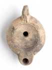 Roman Oil Lamp, 1st - 2nd century AD; height cm 4,5, length cm 11. Provenance: From the collection of a Diplomatic family since 1980s.