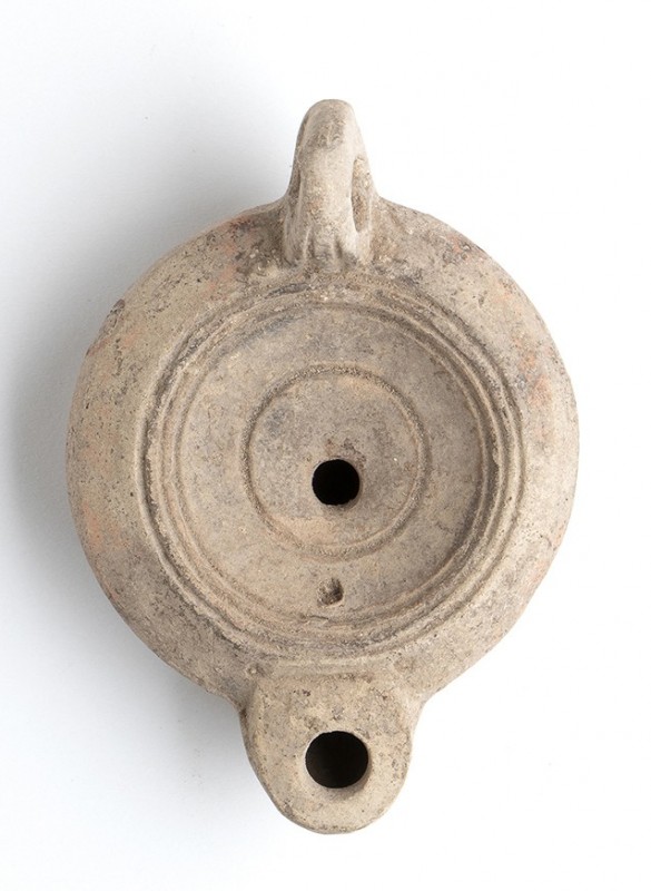 Roman Oil Lamp, 1st - 2nd century AD; height cm 4, lenght cm 10; Stamp on rear. ...