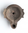 Roman Oil Lamp, 1st - 2nd century AD; height cm 3, length cm 9,5. Provenance: From the collection of a Diplomatic family since 1980s.