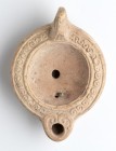 Roman Decorated Oil Lamp, 1st - 2nd century AD; height cm 5,5, length cm 12,5. Provenance: From the collection of a Diplomatic family since 1980s.