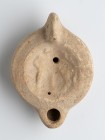 Roman Oil Lamp with Standing Figure, 1st - 2nd century AD; height cm 5, length cm 10,8. Provenance: From the collection of a Diplomatic family since 1...