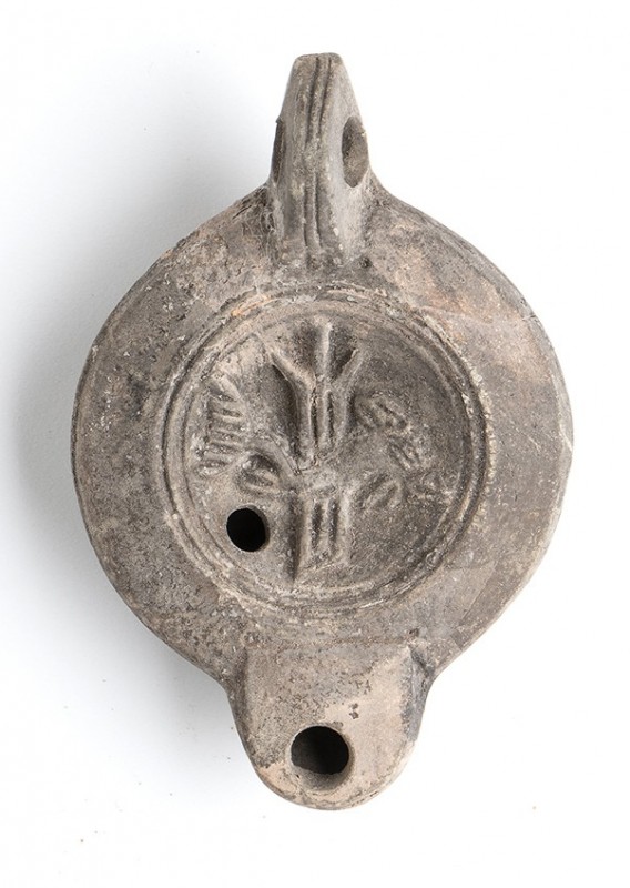 Roman Oil Lamp with Rudder and Fishes, 1st - 2nd century AD; height cm 4,5, leng...