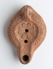 Roman African Oil Lamp with Flower, 4th - 6th century AD; height cm 6, length cm 13,5. Provenance: From the collection of a Diplomatic family since 19...