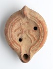 Roman African Oil Lamp with Running Dog, 4th - 6th century AD; height cm 5, length cm 12. Stamp on rear. Provenance: From the collection of a Diplomat...