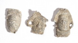 Group of Three Roman Lead Toys, Masks, 1st - 4th century AD; length max cm 2. Provenance: English private collection.
